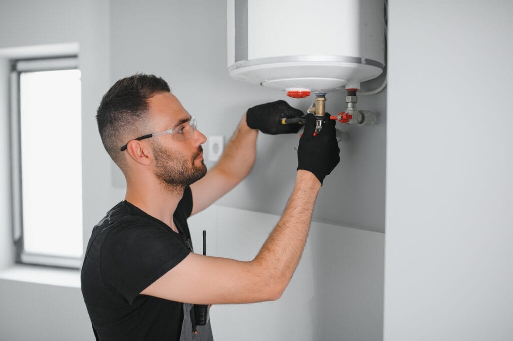 Technician performing water heater maintenance in Fort Myers